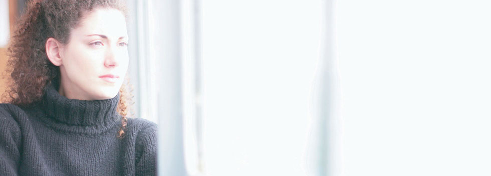 Woman staring outside the window